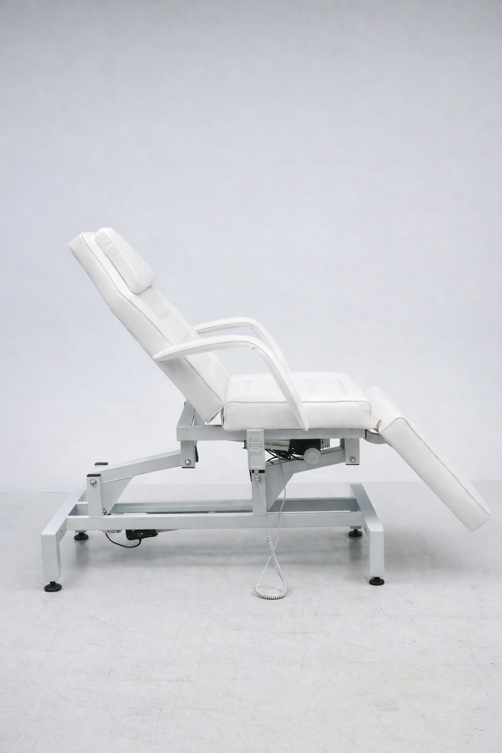 Professional aesthetic treatment chair bed in white vinyl for facials, injectables, laser and skin treatments