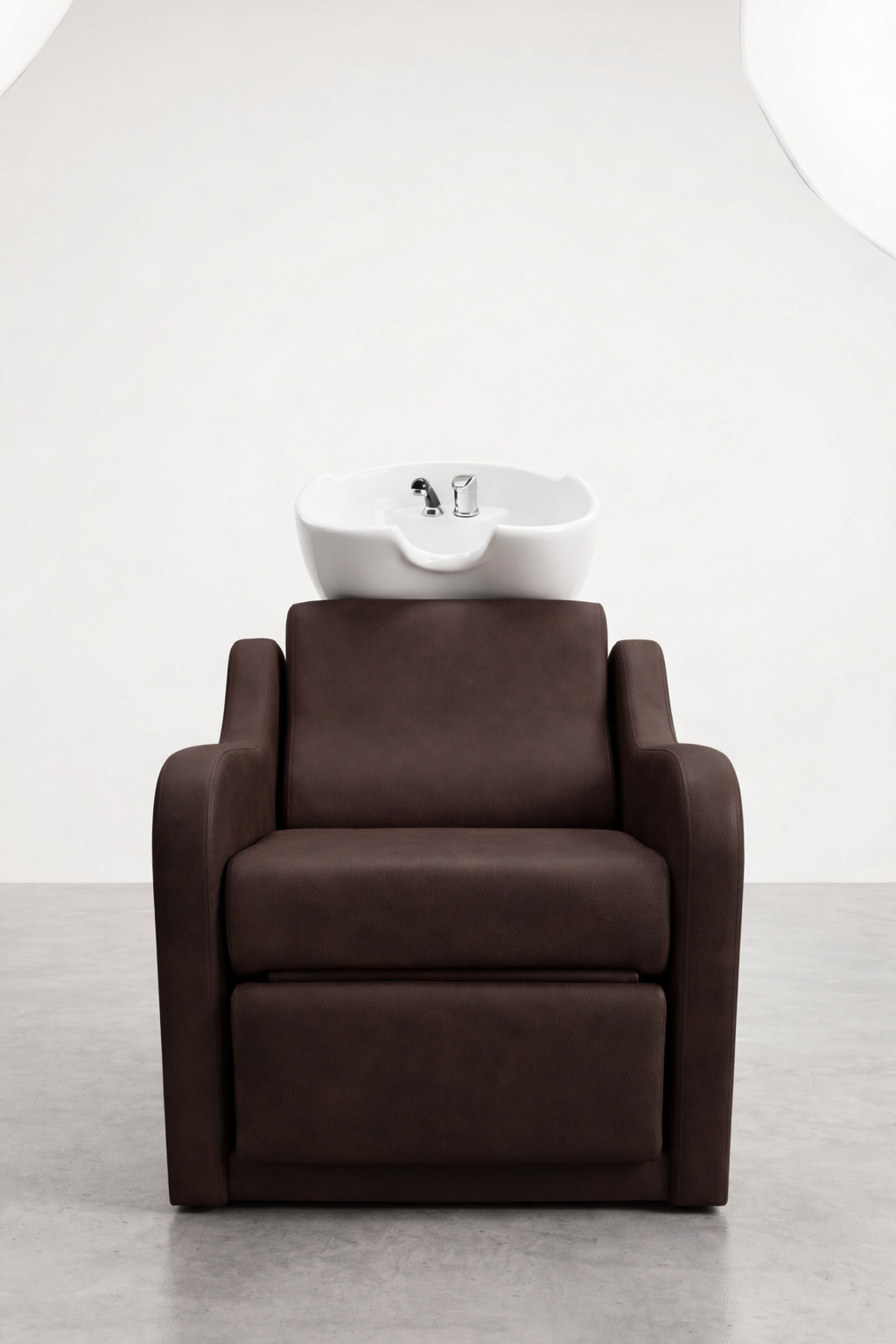 Salon wash chair with rich brown vinyl finish, cushioned seating, and built-in white sink, ideal for commercial hairdressing setups